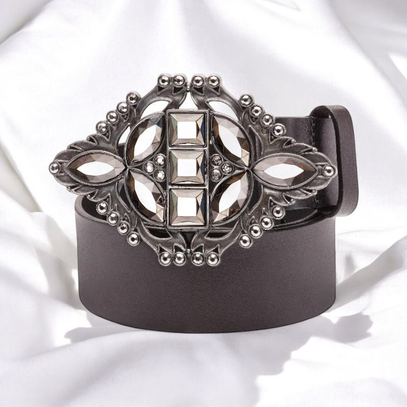 A luxurious black box containing a stunning silver brooch and an elegant belt, exuding sophistication and style.