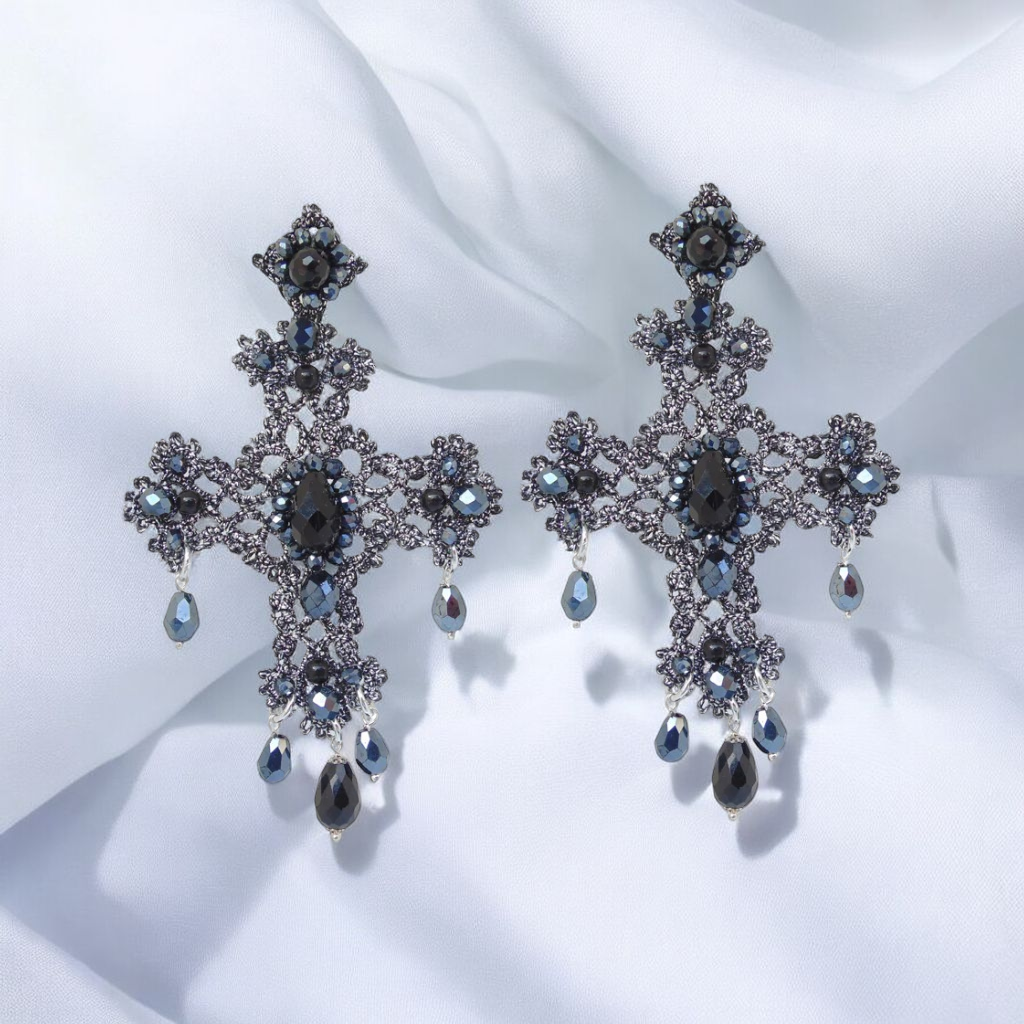 Cross earrings featuring striking black and blue crystals, adding a bold touch to any outfit.