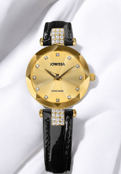 A luxurious gold and black watch adorned with sparkling diamonds on the face, exuding elegance and sophistication.