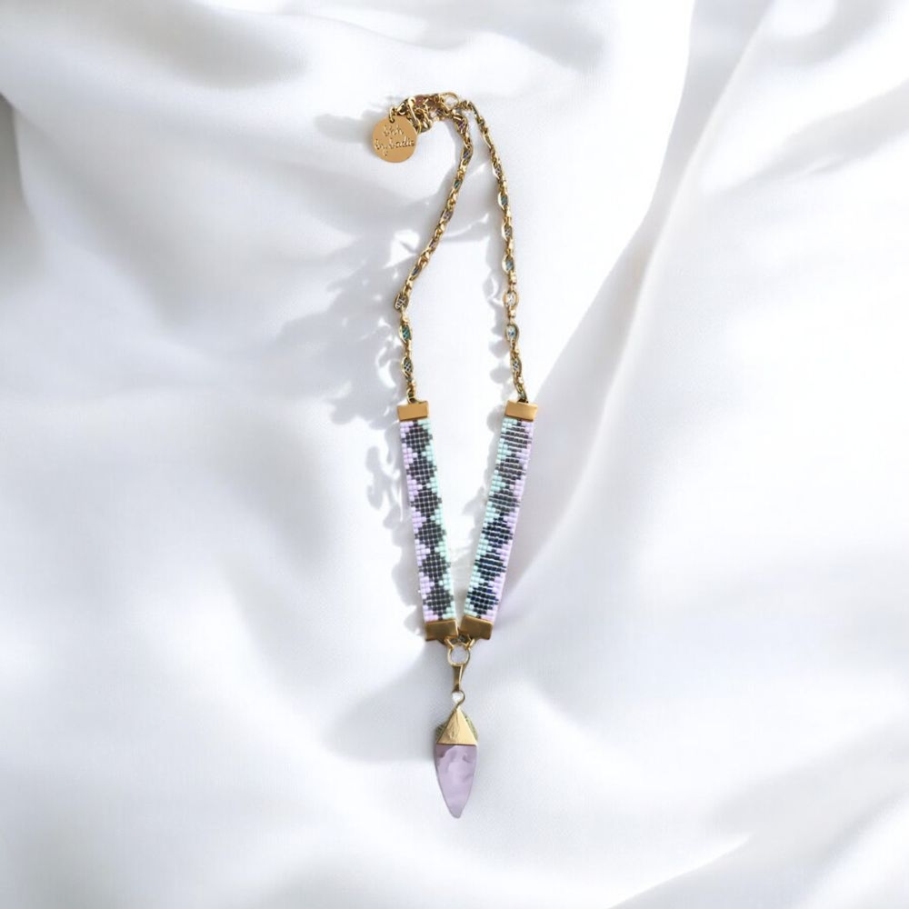 A necklace adorned with purple and gold beads, showcasing a vibrant and elegant design.