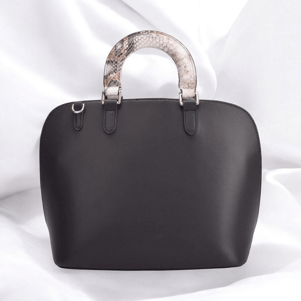 A stylish black leather bag featuring unique snakeskin handles, perfect for adding flair to any outfit.