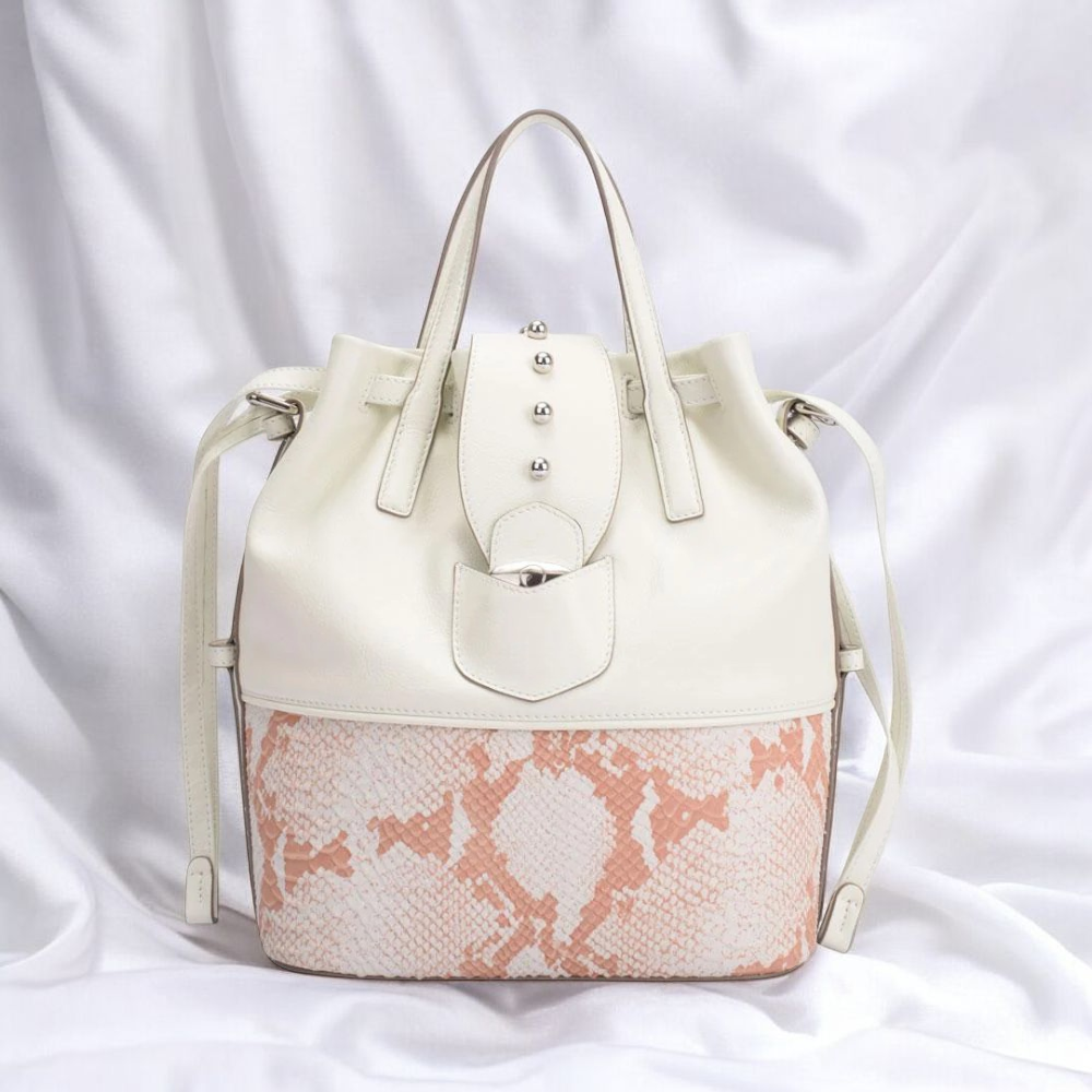 A white leather tote bag featuring a zipper pocket for secure storage and stylish organization.