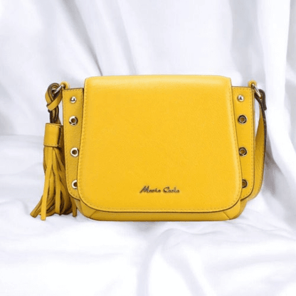 A yellow leather crossbody bag featuring stylish tassels, perfect for adding a pop of color to any outfit.