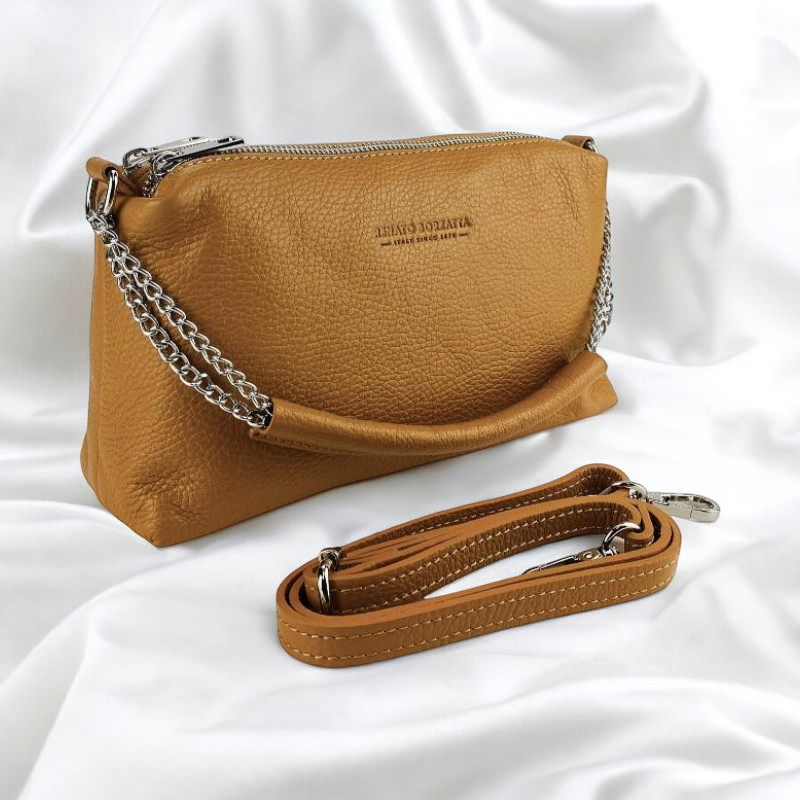 Elegant cognac purse featuring a chic chain and strap, perfect for adding a touch of sophistication to any ensemble.