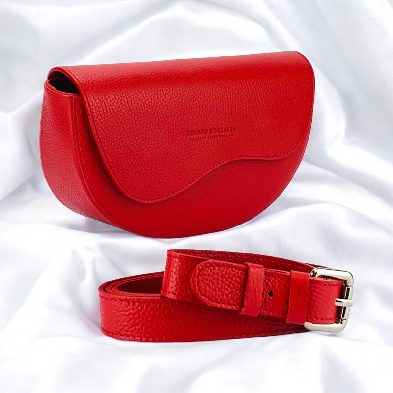 A red leather purse and matching belt featuring a stylish buckle, elegantly displayed on a neutral background.