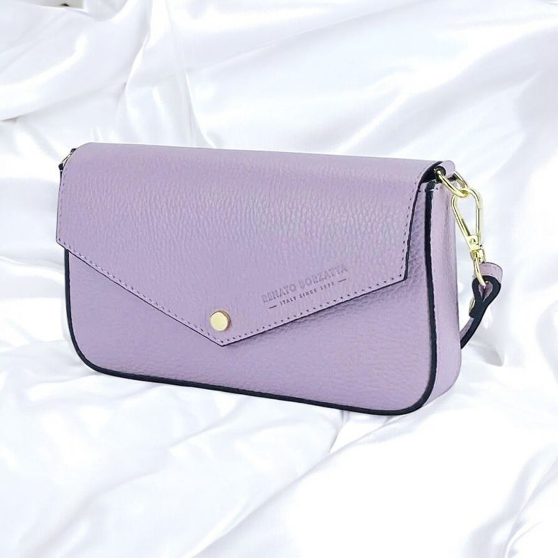 A purple leather crossbody bag featuring a stylish gold clasp, perfect for adding a pop of color to any outfit.