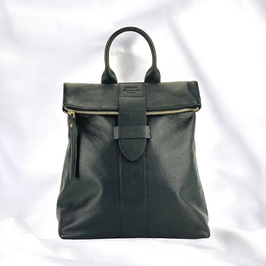 A sleek black leather backpack featuring dual zippers, exuding elegance and sophistication in every detail.