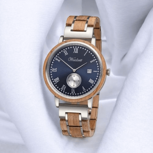 A wooden watch featuring a blue dial and a silver bracelet, showcasing a blend of natural and modern design elements.