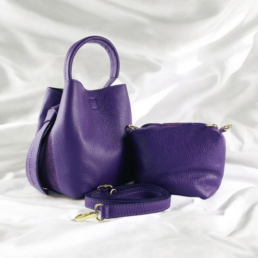 Elegant purple leather handbag featuring a chic strap, perfect for adding a touch of luxury to any ensemble.