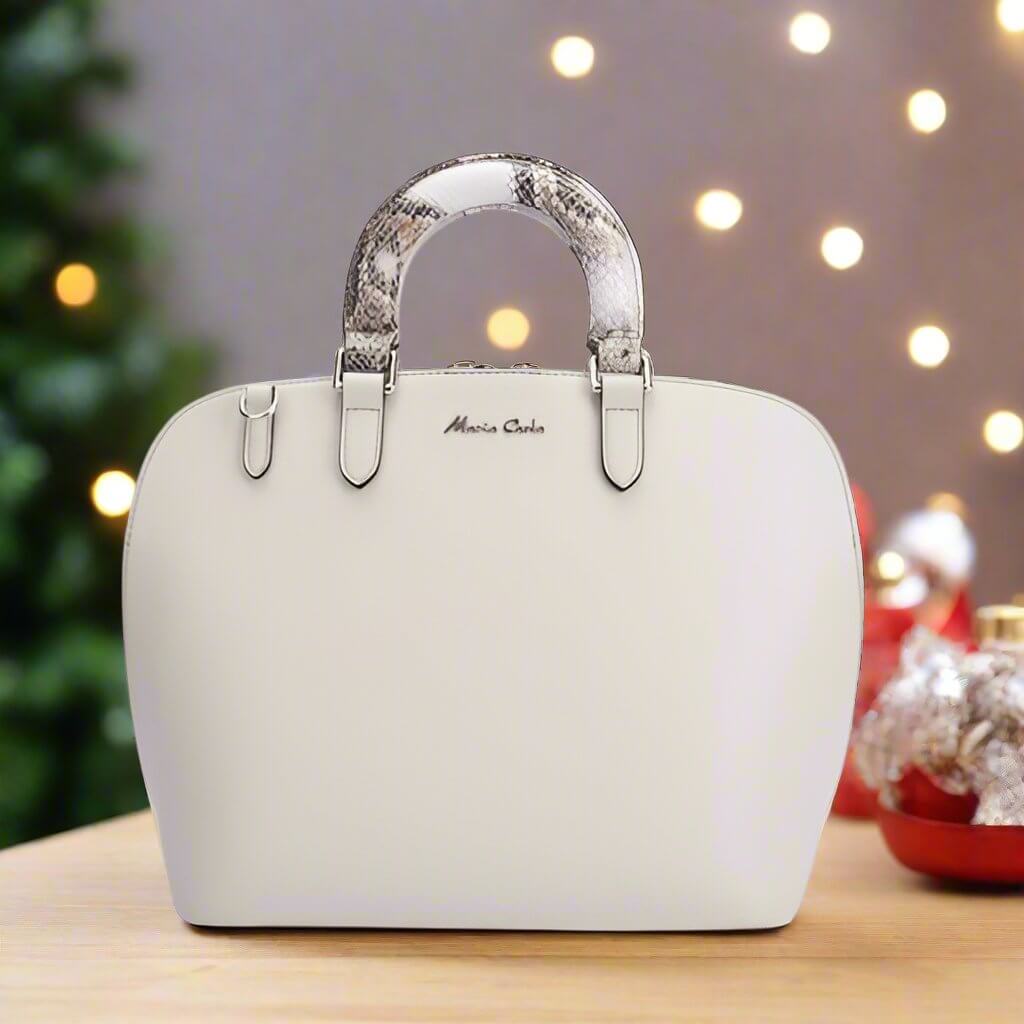 A stylish white leather bag featuring unique snakeskin handles, perfect for adding flair to any outfit.