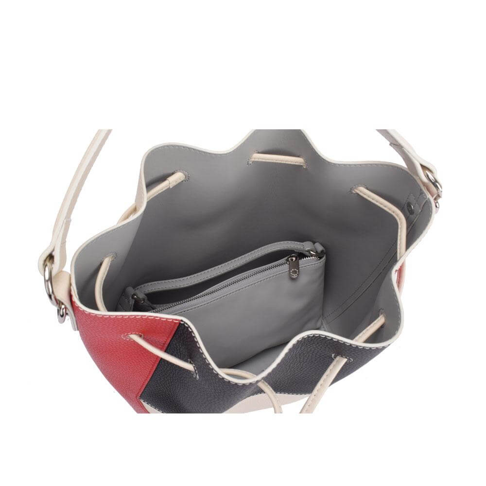 A stylish red, black, and white handbag featuring a zipper, perfect for adding a pop of color to any outfit.