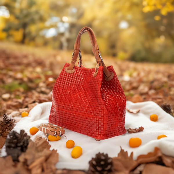  Luxurious red woven bag with dual handles and a refined leather strap, perfect for any stylish occasion.