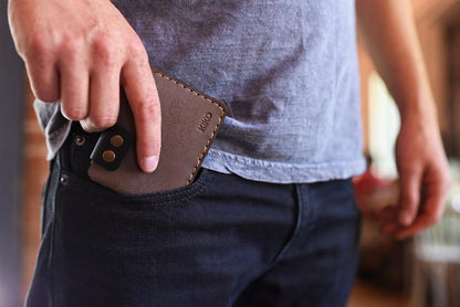 A man with a wallet tucked into his pocket, exuding a sense of ease and confidence.