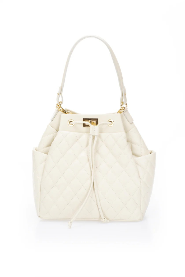  Elegant beige quilted handbag adorned with a luxurious gold chain, exuding sophistication and timeless style.