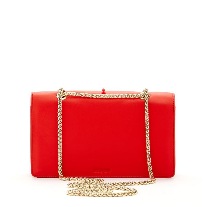 A stylish red purse featuring eye-catching studded detailing on the front, perfect for adding flair to any outfit.