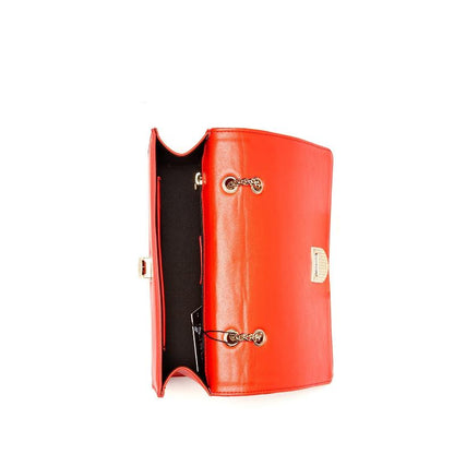 An open red leather purse showcasing the interior, featuring a stylish metal clasp.