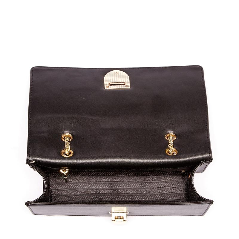 A stylish black leather bag featuring two spacious compartments for organized storage.