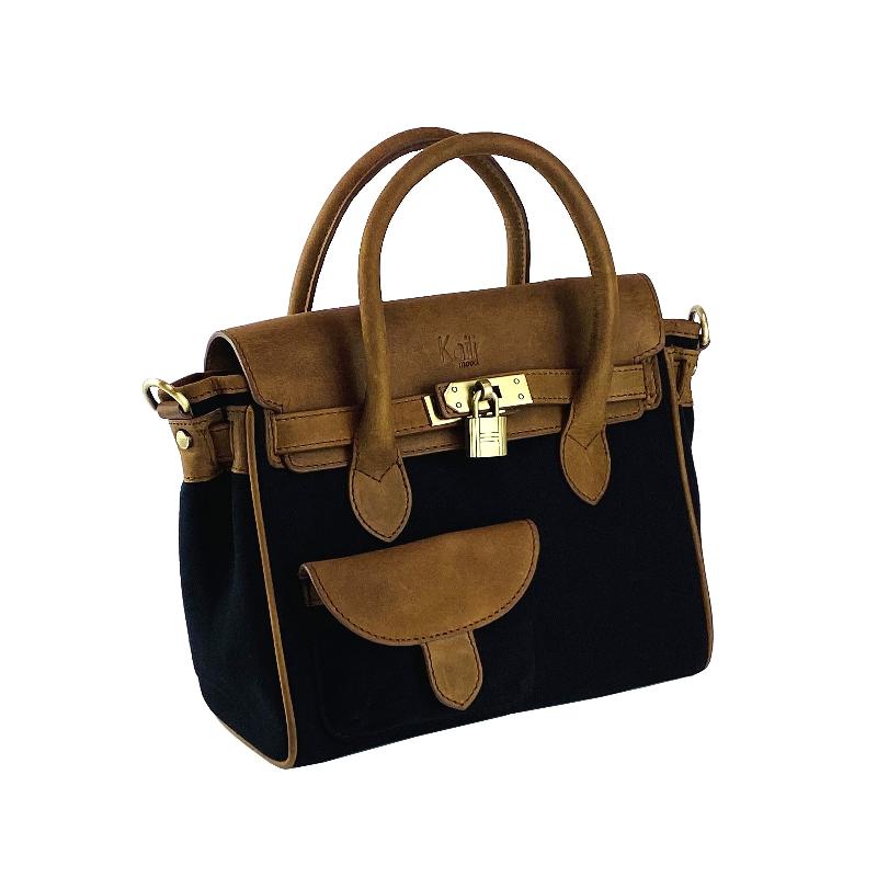 A sophisticated black and tan handbag featuring a stylish strap, perfect for elevating any ensemble with elegance.