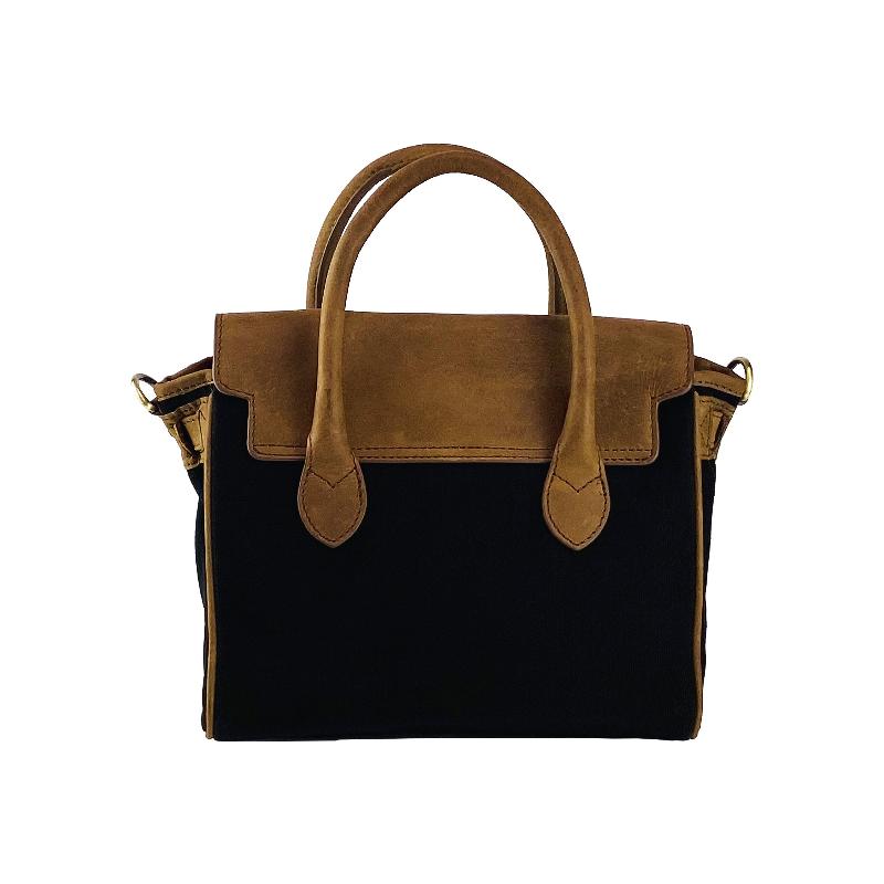 A sophisticated black and tan handbag featuring a stylish strap, perfect for elevating any ensemble with elegance.