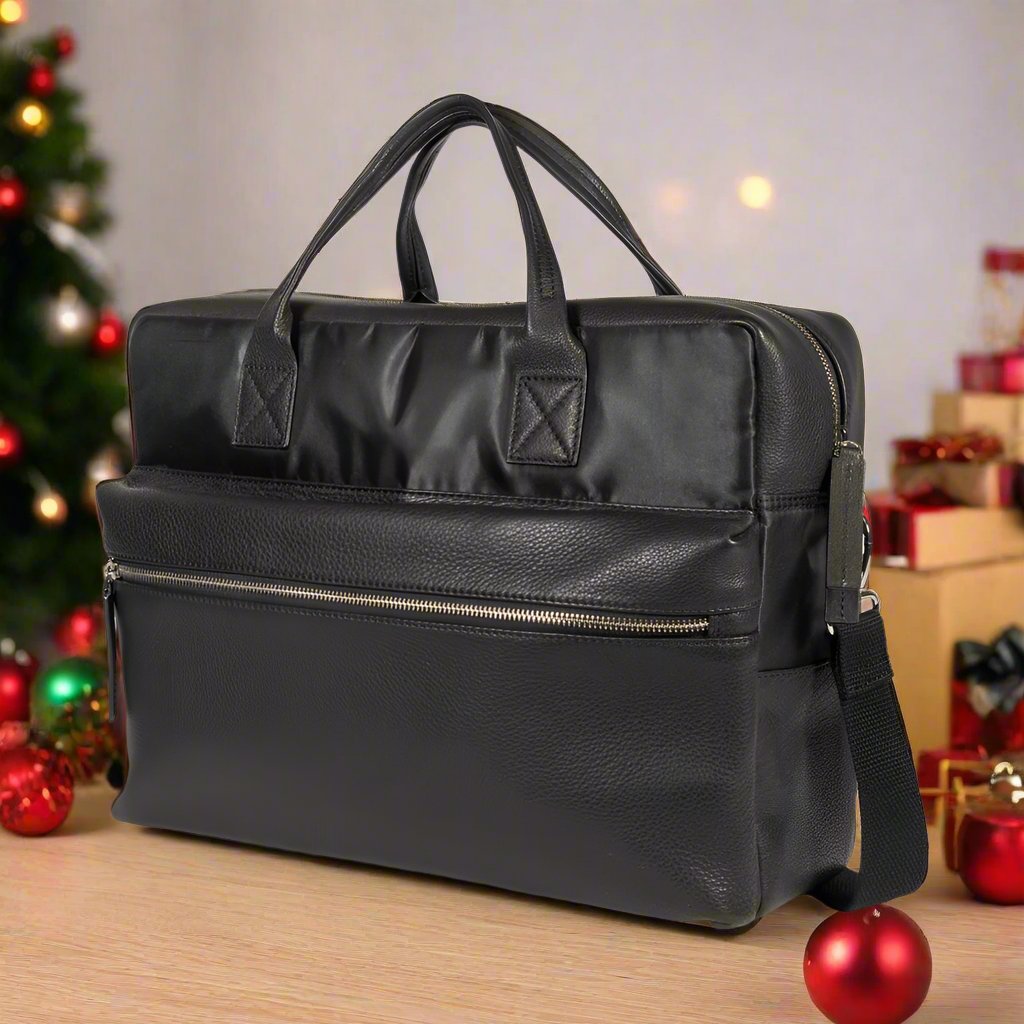  A sleek black leather briefcase designed specifically for securely holding a laptop and other essential items.