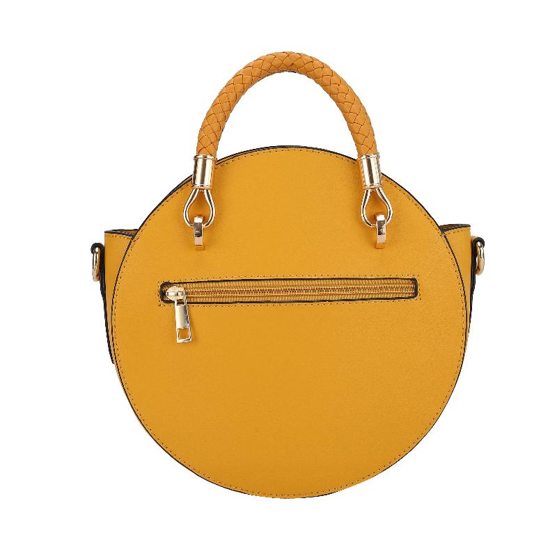 A yellow vegan leather bag featuring a stylish chain strap, showcasing a blend of elegance and modern design.
