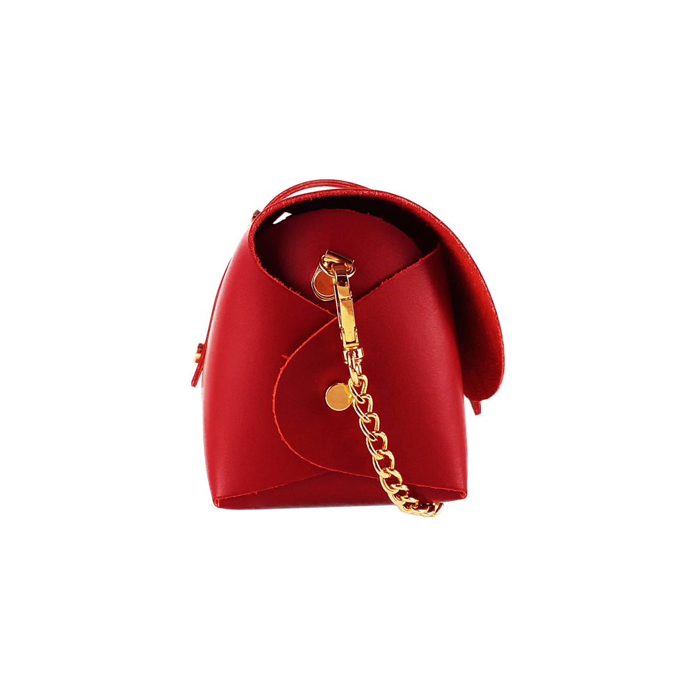 A red leather bag featuring a gold chain and a gold clasp, elegantly designed for a stylish appearance.