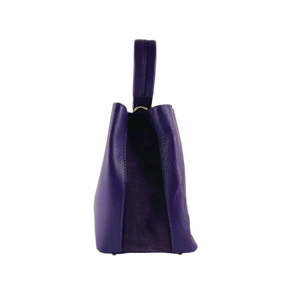 Elegant purple leather handbag featuring a chic strap, perfect for adding a touch of luxury to any ensemble.