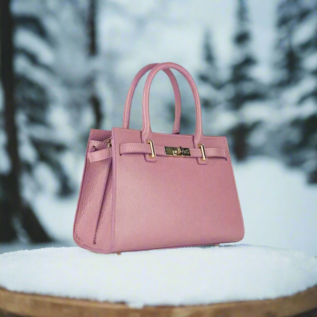 Elegant pink calfskin handbag, showcasing luxurious leather craftsmanship and a chic design for the discerning fashionista.