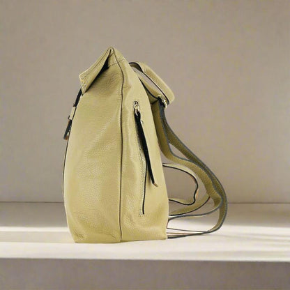 Tan leather backpack featuring a front zipper, showcasing a stylish and functional design for everyday use.