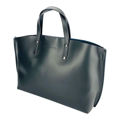 A sophisticated black leather tote bag elegantly displayed, showcasing its luxurious texture and timeless design.