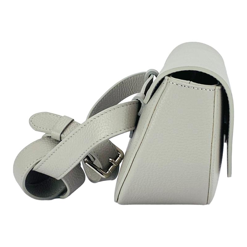  An exquisite grey leather belt bag affixed to a purse, highlighting a harmonious fusion of luxury and practicality.