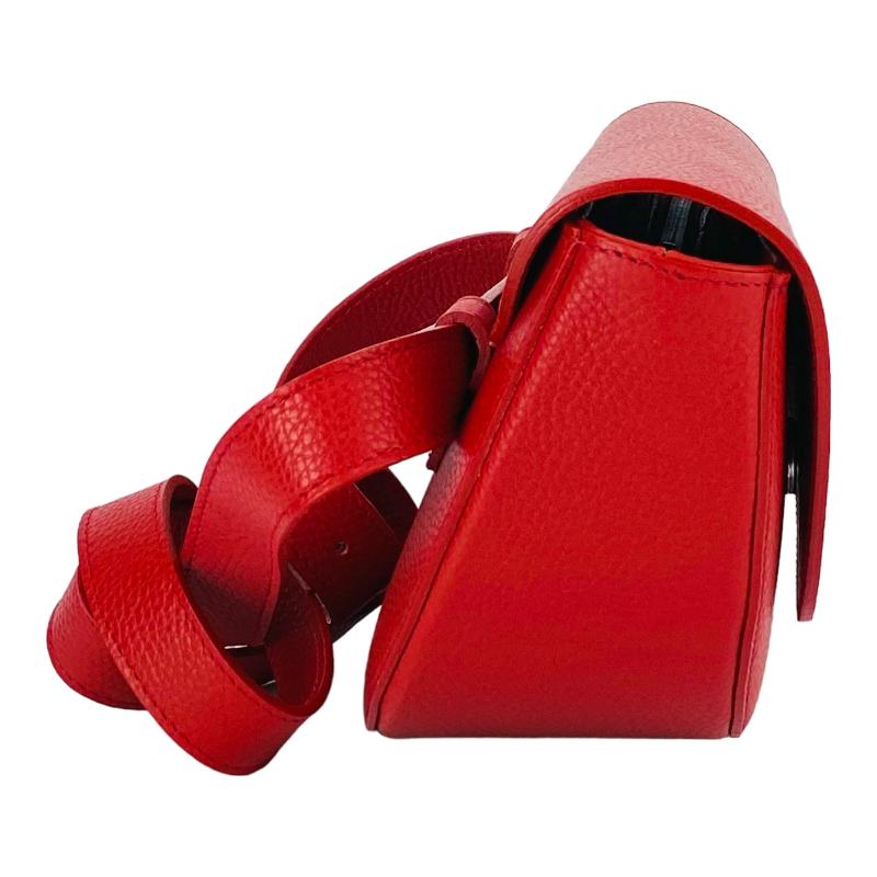 A red leather purse and matching belt featuring a stylish buckle, elegantly displayed on a neutral background.