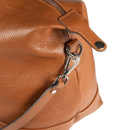 A luxurious close-up of a tan leather bag, showcasing its rich texture and exquisite craftsmanship.