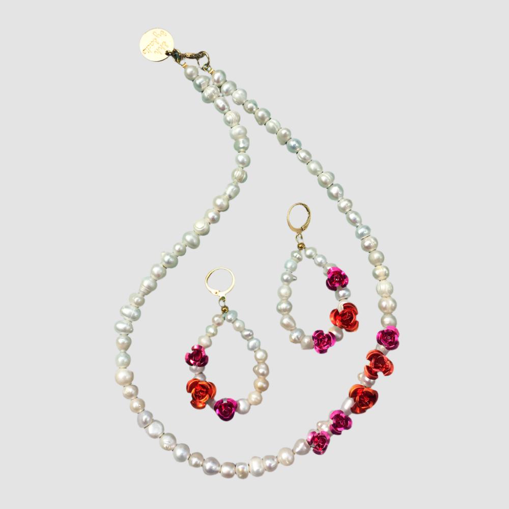 Elegant pearl necklace and earrings set adorned with vibrant red flowers, perfect for adding a touch of sophistication.