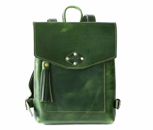 Stylish green leather backpack featuring decorative tassels and studs, perfect for adding flair to any outfit.