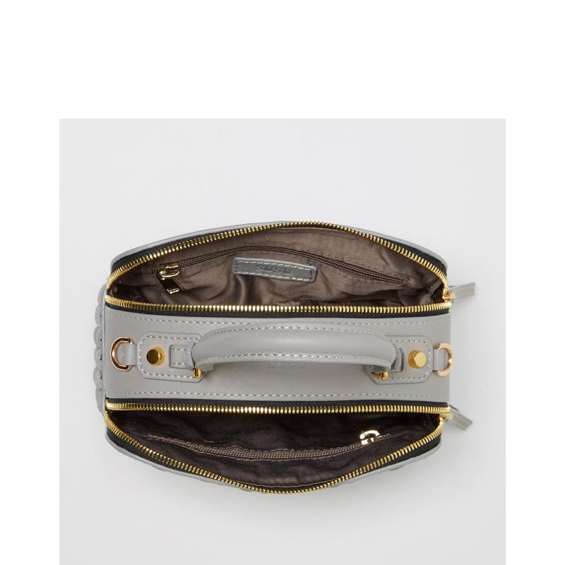 Small black crossbody purse featuring elegant gold hardware, two zipper, perfect for stylish and convenient everyday use.