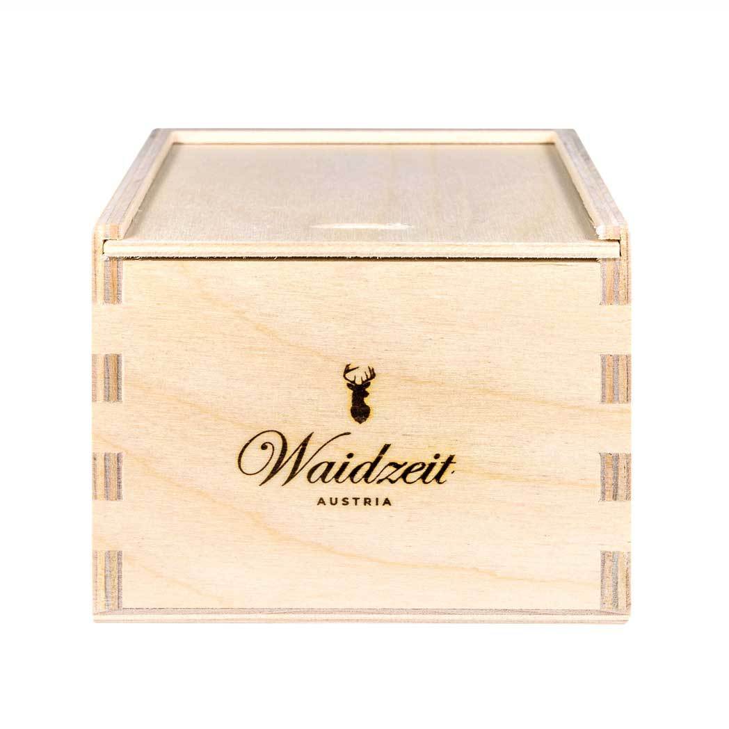 A wooden box featuring the inscription "waldzeit" elegantly displayed on its surface.