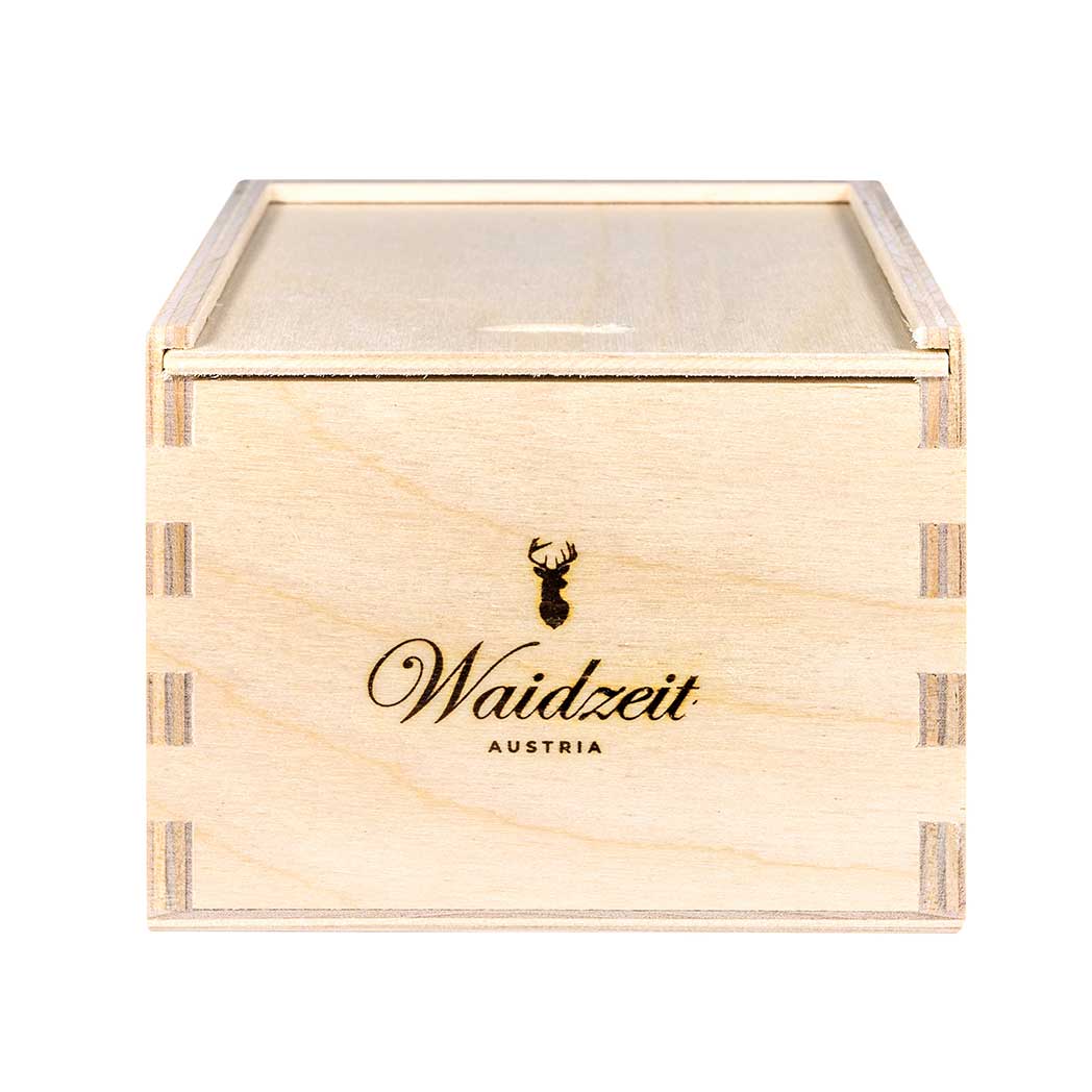 A wooden box featuring the inscription "waldzeit" elegantly displayed on its surface.