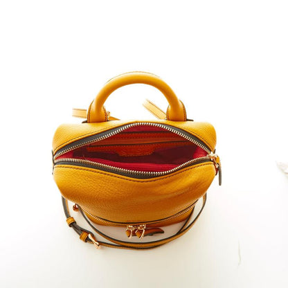 A yellow purse featuring a side zipper, showcasing a stylish and functional design.

