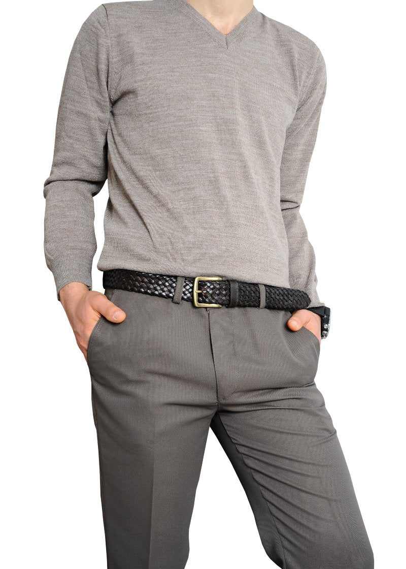 A man in a gray sweater and pants, showcasing a stylish belt that adds flair to his outfit.