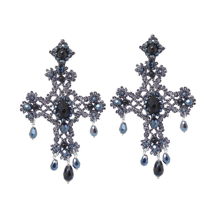 Cross earrings featuring striking black and blue crystals, adding a bold touch to any outfit.