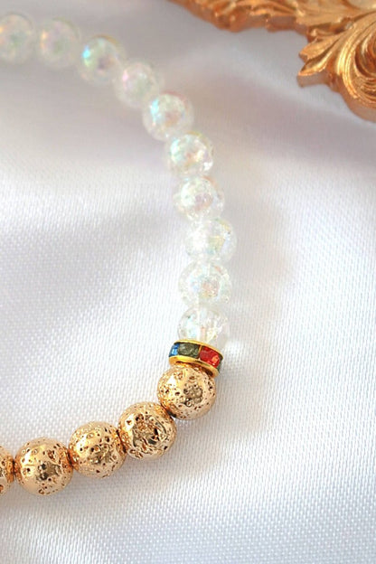 Elegant gold and white bracelet adorned with luminous white opal beads, exuding timeless luxury and sophistication.