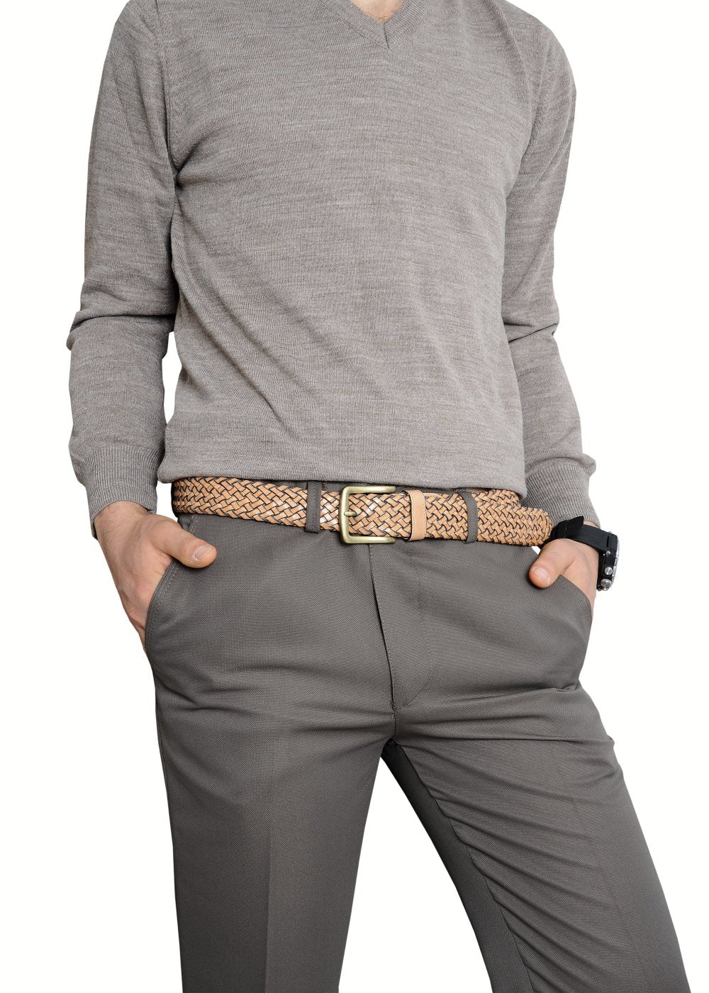 A man in a gray sweater and pants, showcasing a stylish belt that adds flair to his outfit.