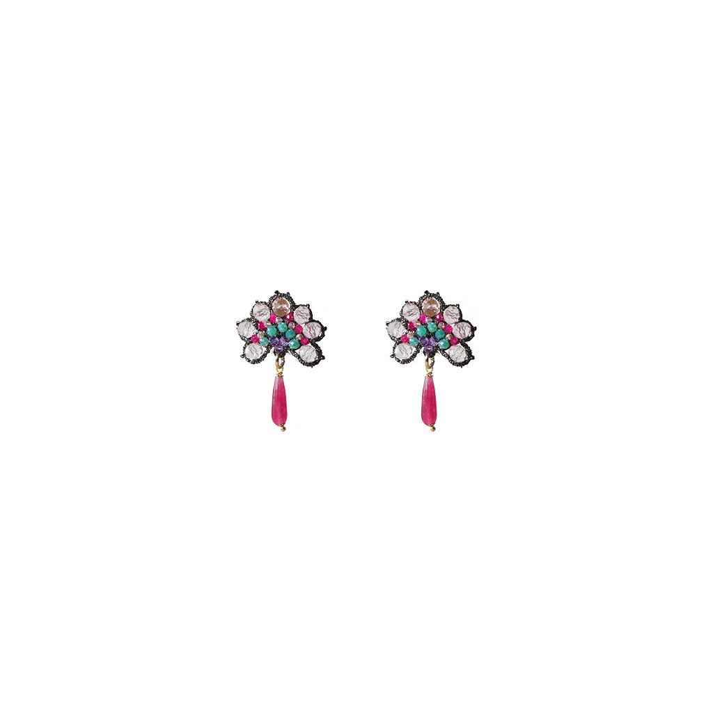 A pair of earrings featuring vibrant, colorful stones set in an elegant design.