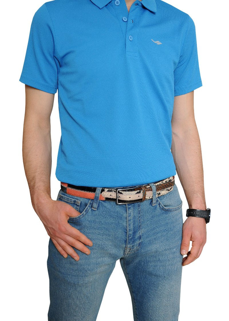 A man wearing a blue shirt with jeans, with a stylish black-white-orange leather belt.