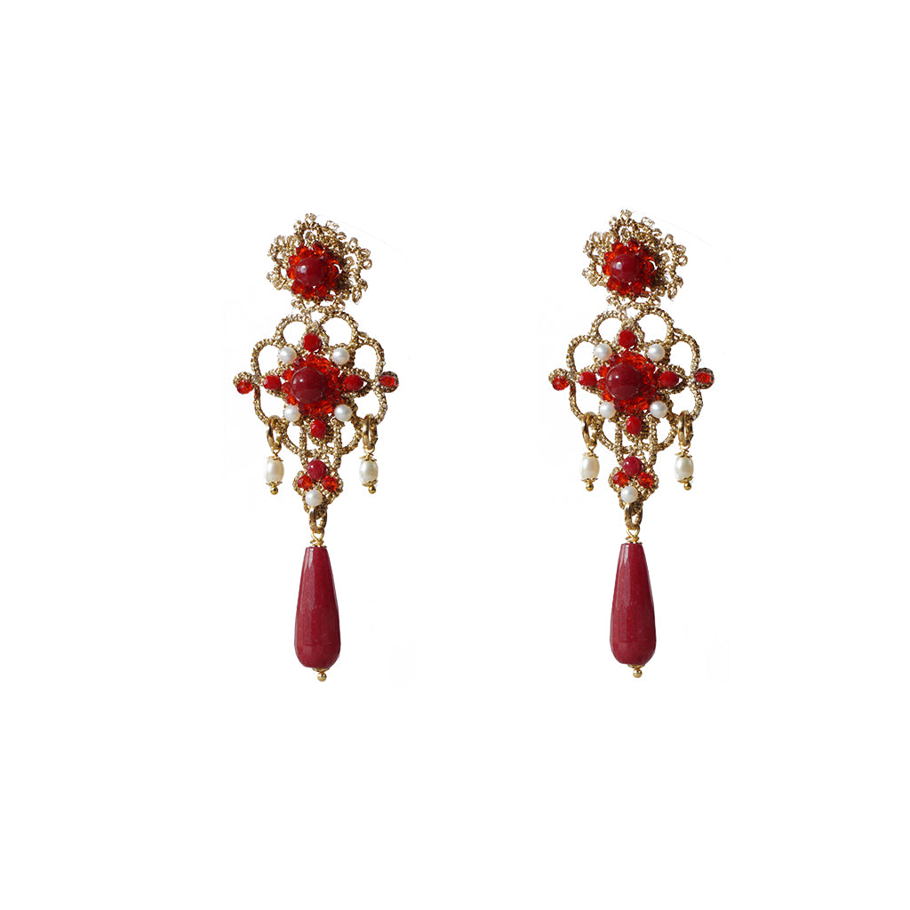 A pair of elegant red and gold earrings, showcasing a striking design and vibrant colors.