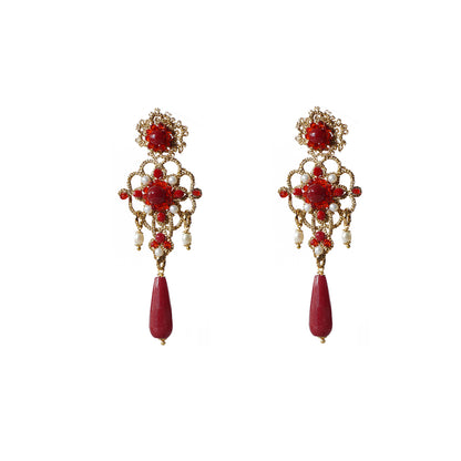 A pair of elegant red and gold earrings, showcasing a striking design and vibrant colors.