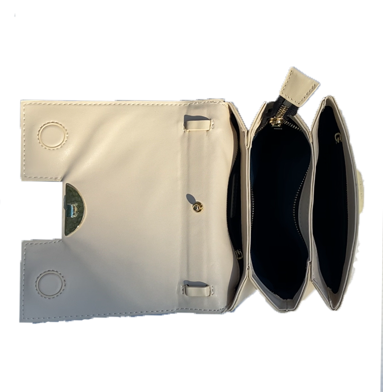 3. A trendy white leather bag showcasing a front zipper, combining functionality with a touch of sophistication.

