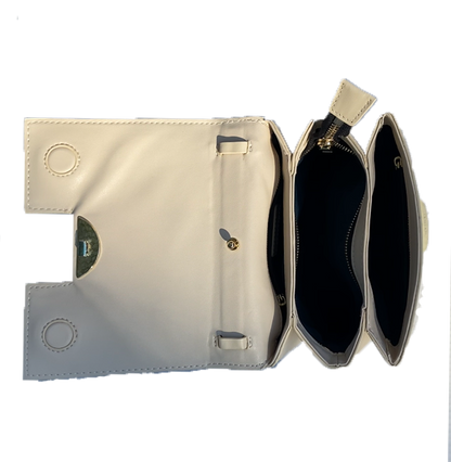 3. A trendy white leather bag showcasing a front zipper, combining functionality with a touch of sophistication.

