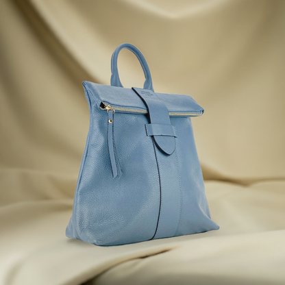 A blue leather backpack featuring a front zipper, showcasing a stylish and functional design.